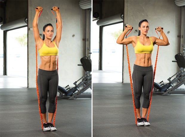 Two-Arm Shoulder Press Woman doing two-arm shoulder press as part of total body challenge called your best body