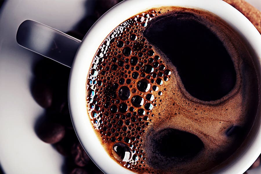 Black coffee cup and beans