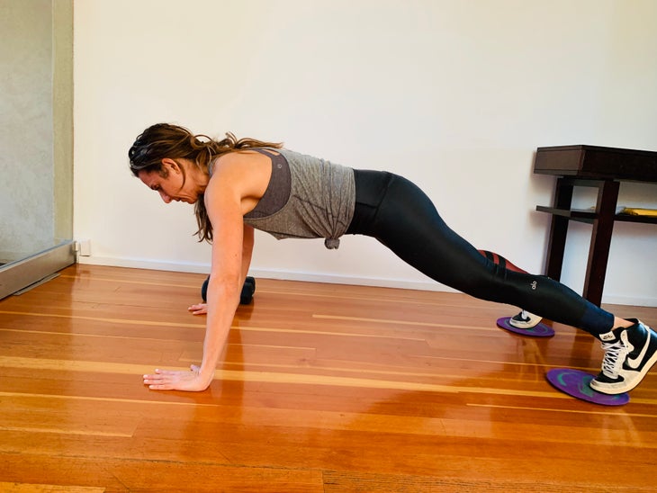 Pike To Push Up 2 fit woman doing a pike to push-up