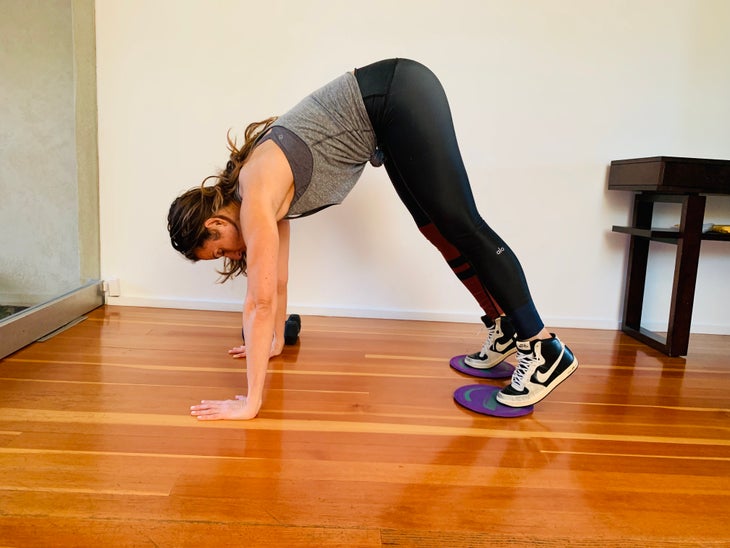 Pike To Push Up 3 fit woman doing a pike to push-up