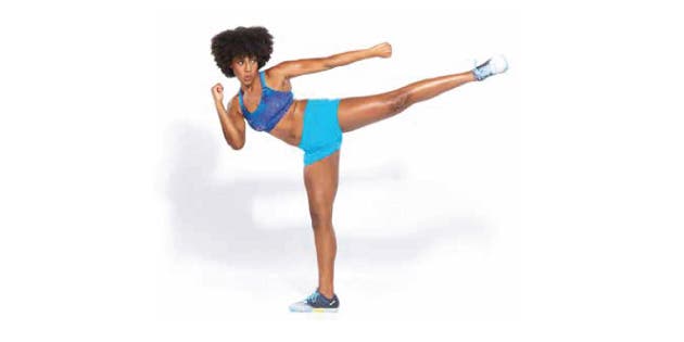 Woman boxing in roundhouse kick stance