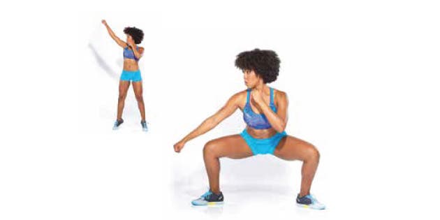 Woman boxing in high/low punch stance