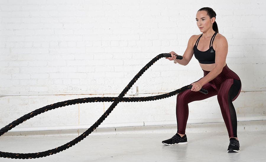 Woman Exercising Battle Ropes Wave