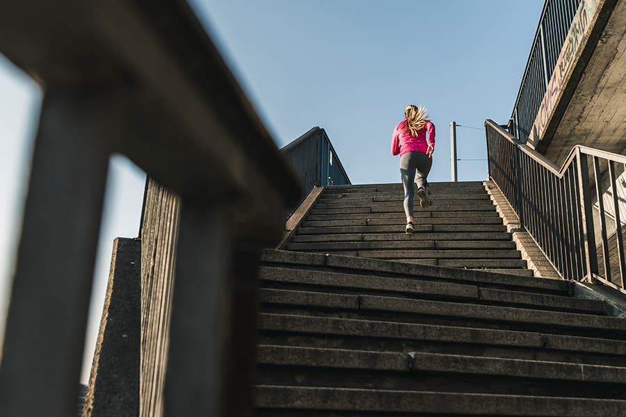 Fit woman running stairs