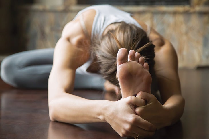 Streching-Oxygen Woman stretching in yoga pose