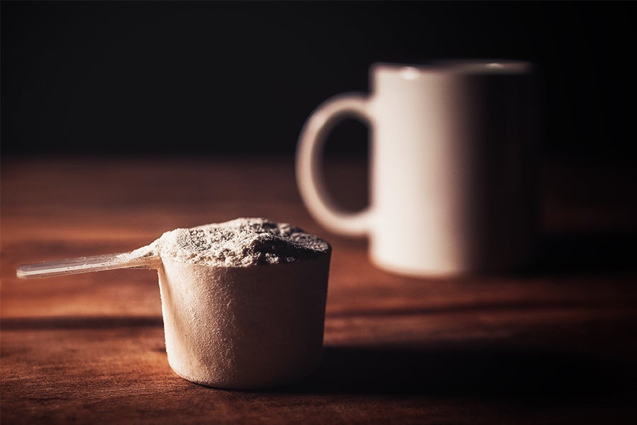Protein Powder next to Mug
