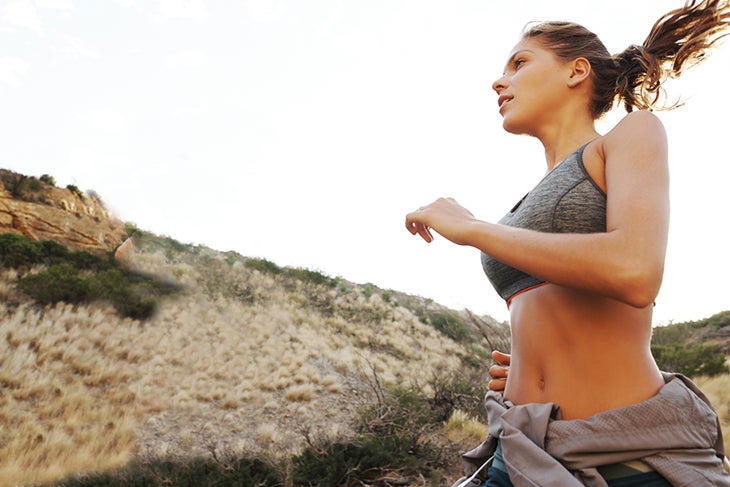 Woman Running Woman breathing while running outdoors