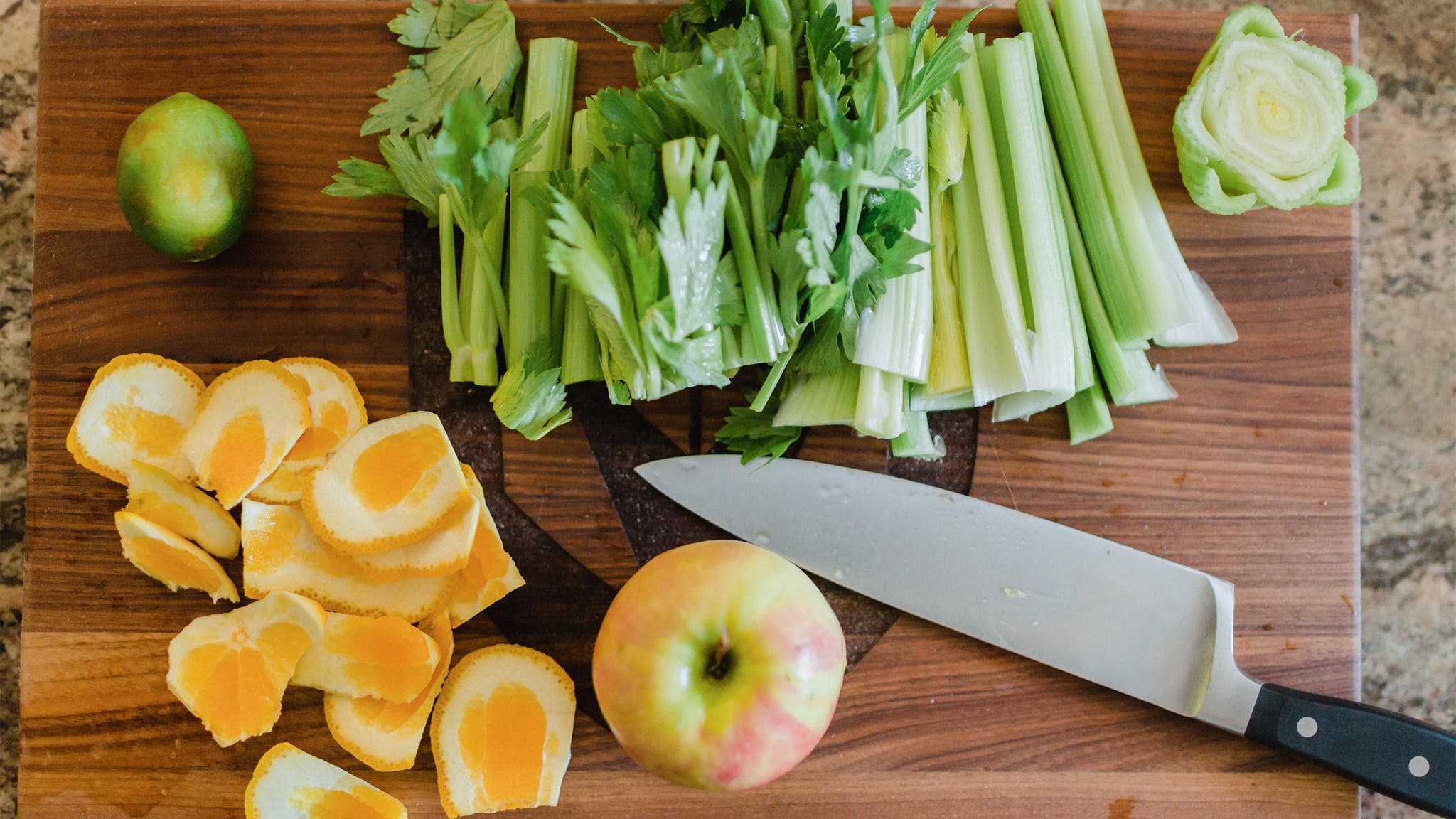 Fruits and vegetables on a cutting board.