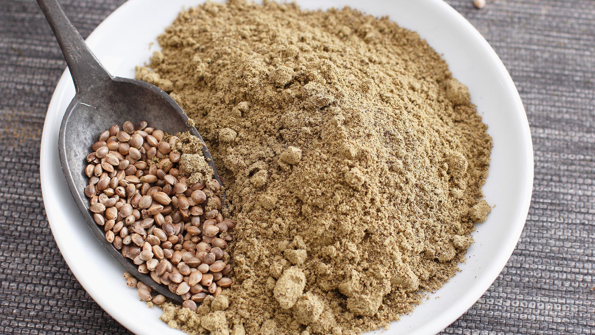 A bowl of hempseeds and hemp powder.