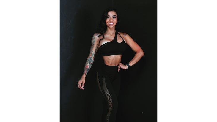 Stacy Correa against a black background