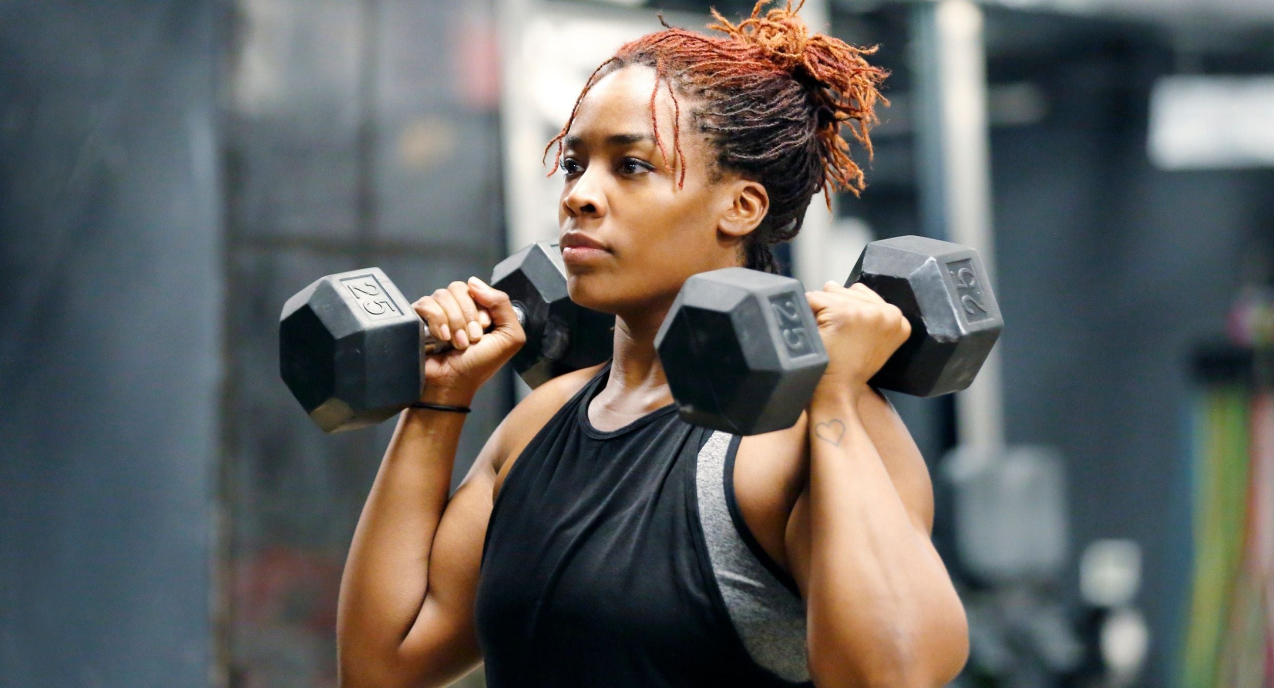 Premium Photo  Female bodybuilder doing heavy weight exercise for biceps